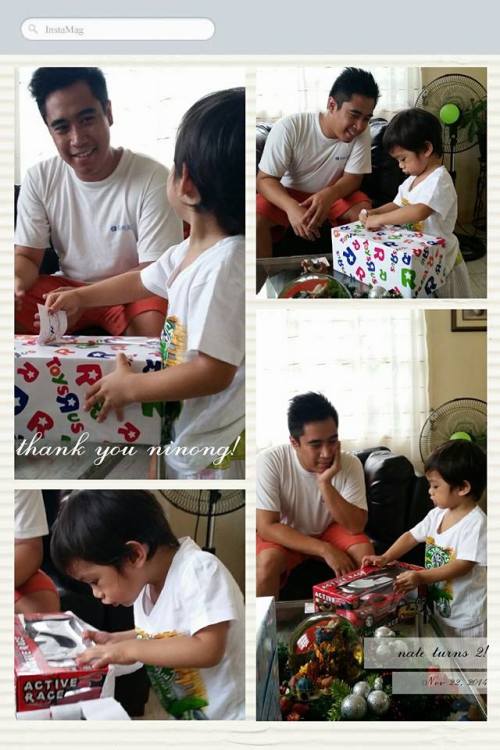 Look how serious he is in opening his gifts while his Ninong looks on.
